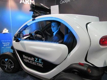 Renault's Pierre Delaigue inside Twizy at ARM's booth